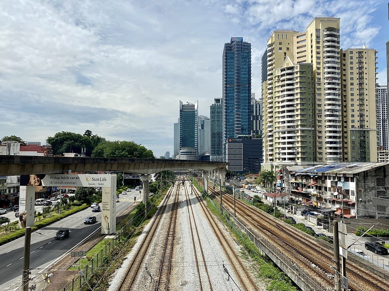 Rail tracks and the LRT viaduct in Brickfields looking toward KL Sentral, photographed in July 2023