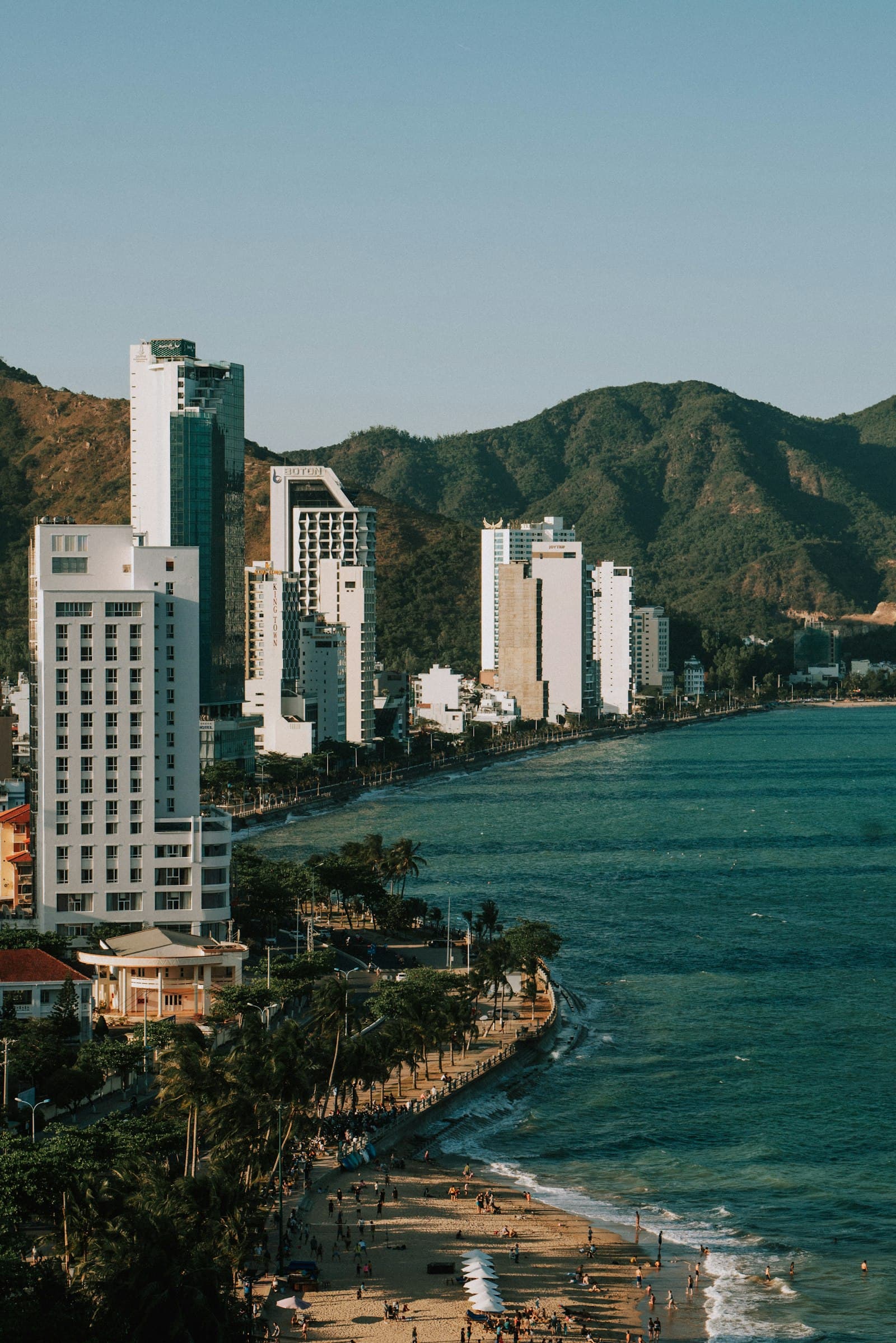 Nha Trang beach and high-rise coastline with mountains behind the bay