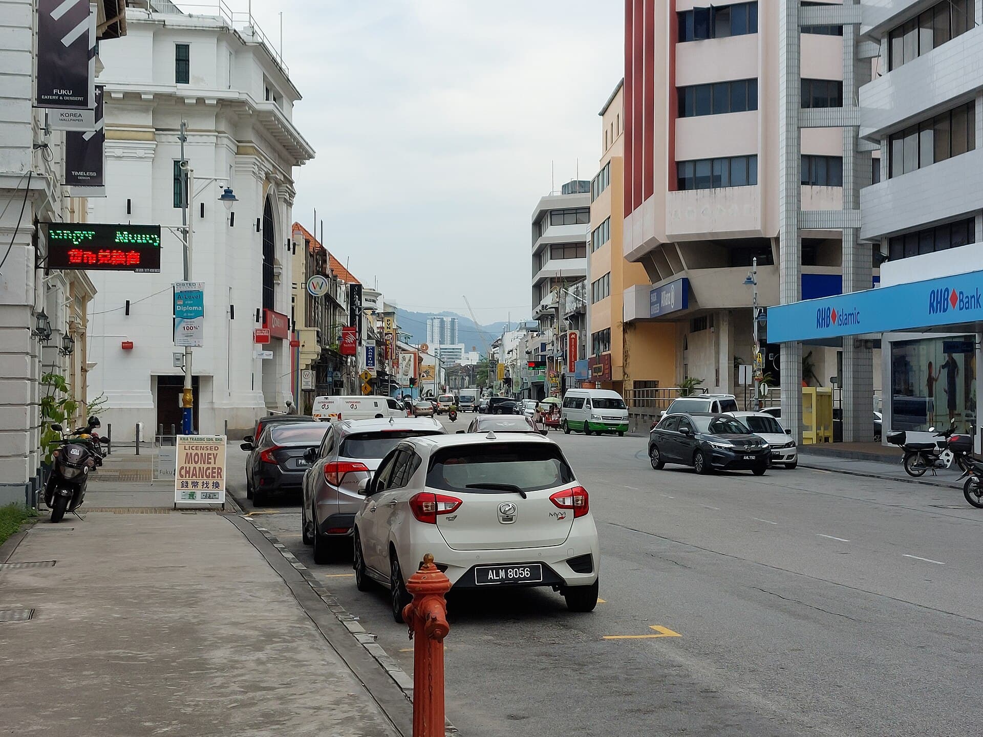 Beach Street in George Town, Penang, shophouses and a working street